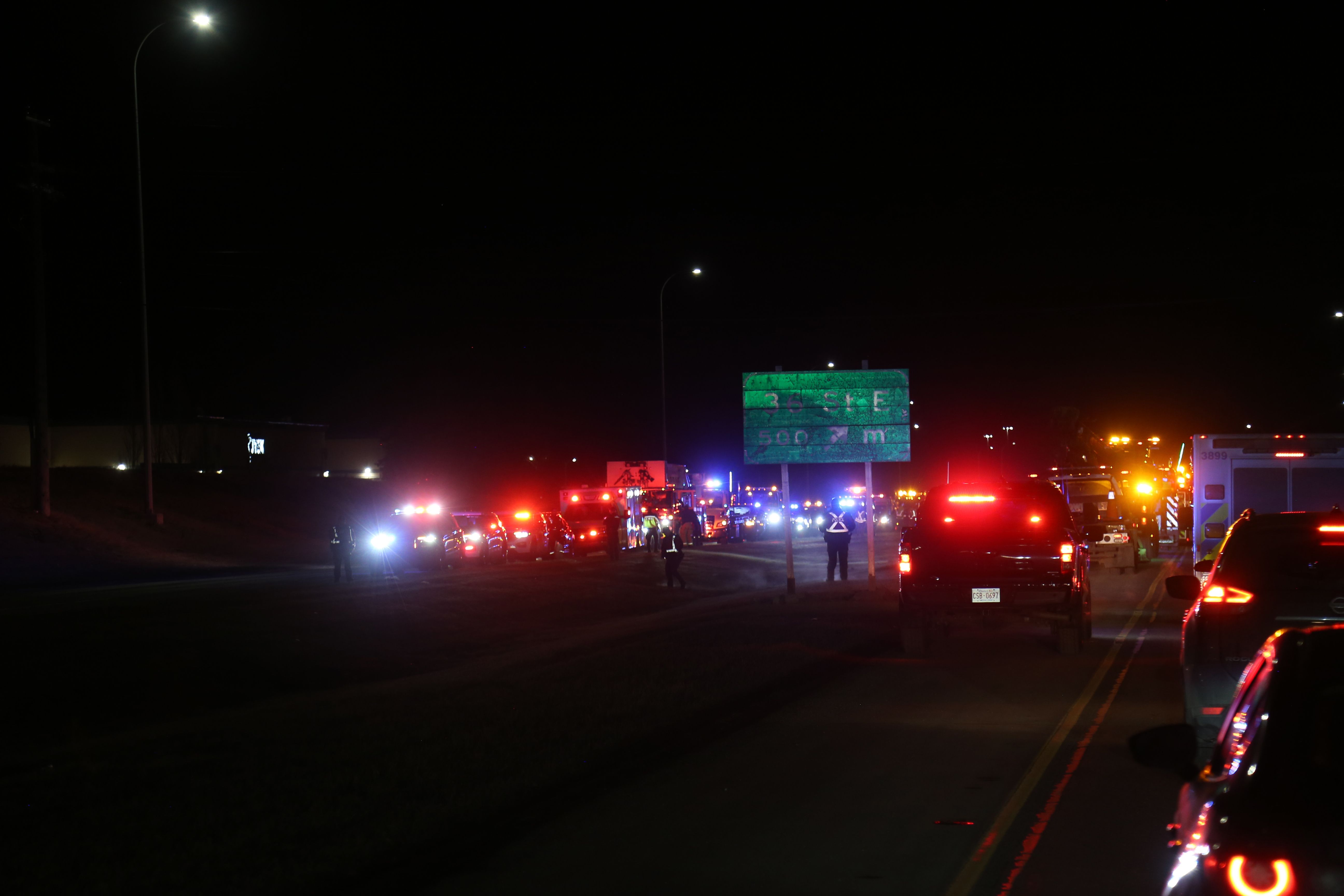Emergency vehicles and tow trucks line 16 Avenue N.E. in Calgary during the Slow Down Move Over awareness campaign on March 5, 2026. Photo / Anna Ferensowicz / Discover Airdrie